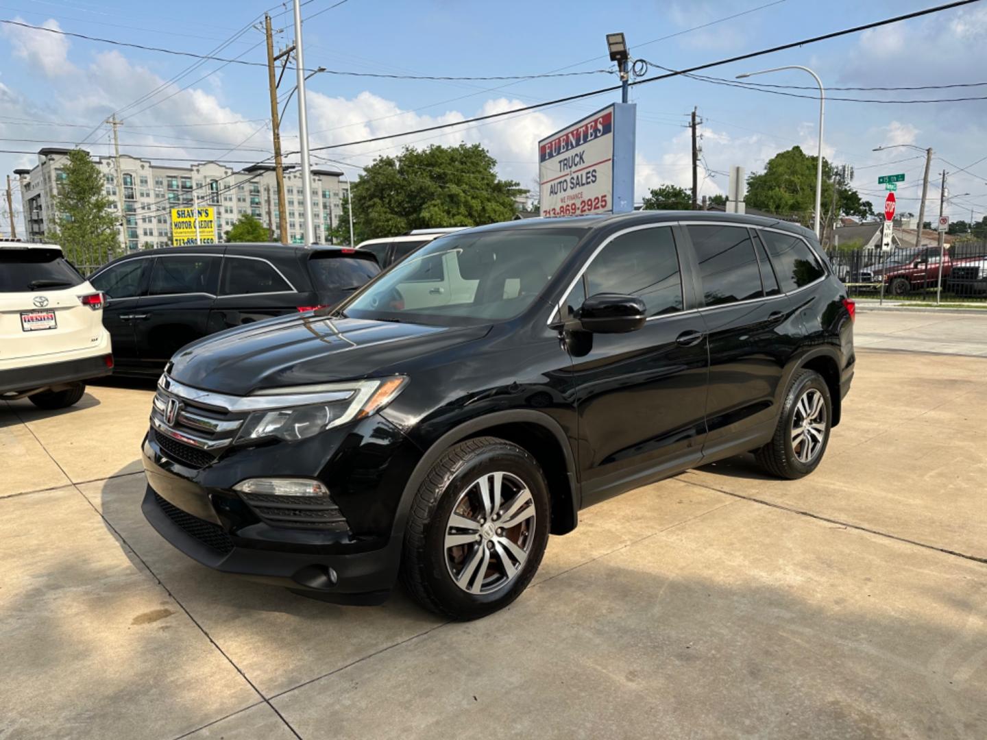 2016 Black /Silver Honda Pilot EX-L (5FNYF5H57GB) with an 3.5L engine, Automatic transmission, located at 1501 West 15th St., Houston, 77008, (713) 869-2925, 29.797941, -95.411789 - Photo#0